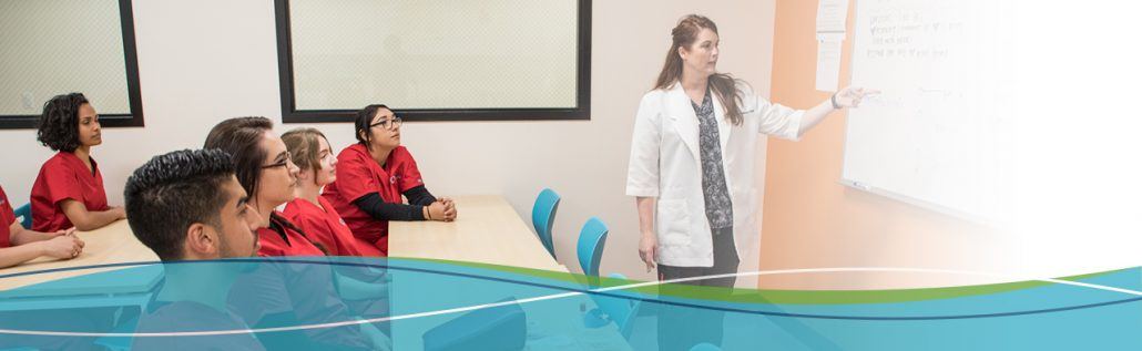 Instructor teaches an interested class