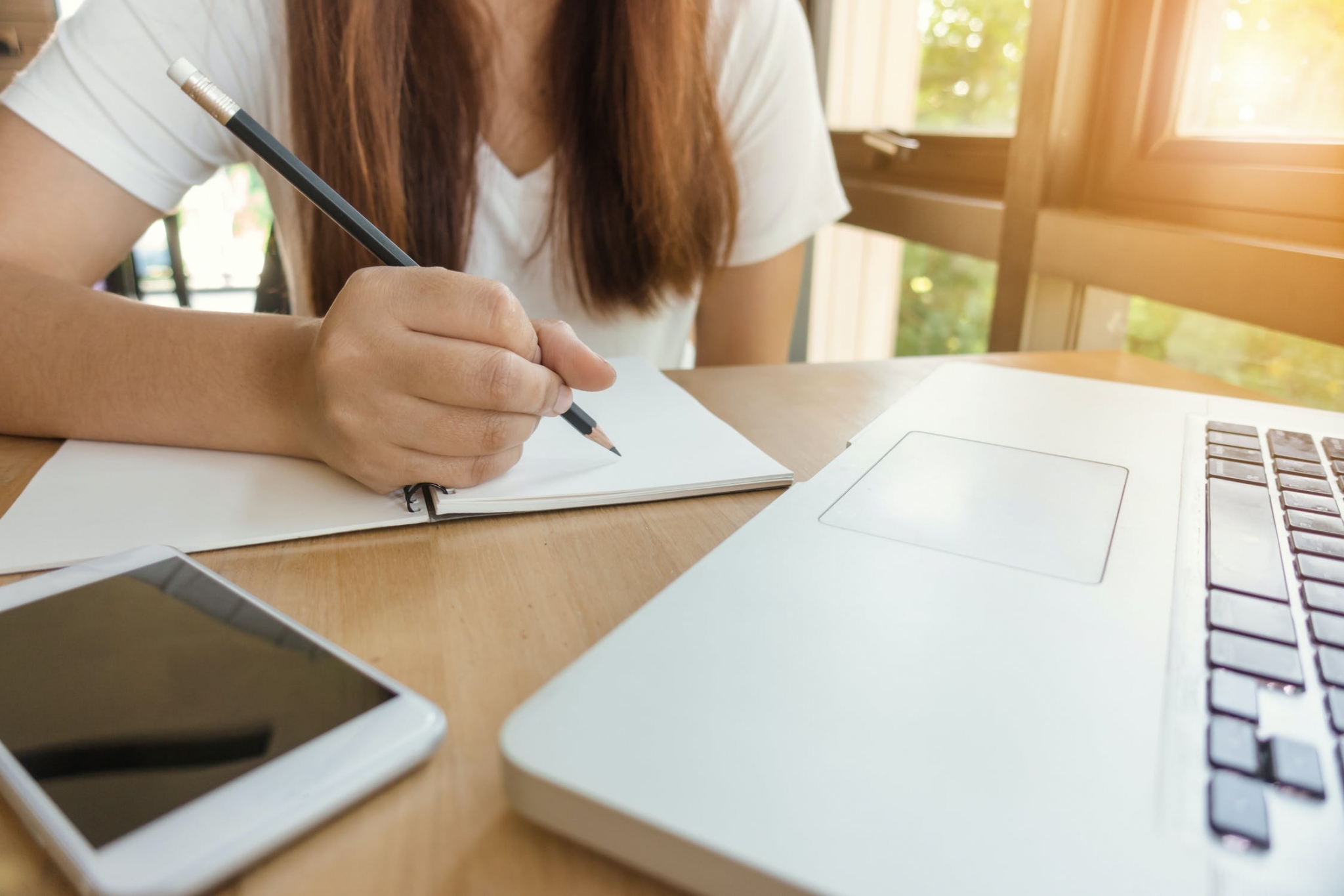 Woman writing in a notebook