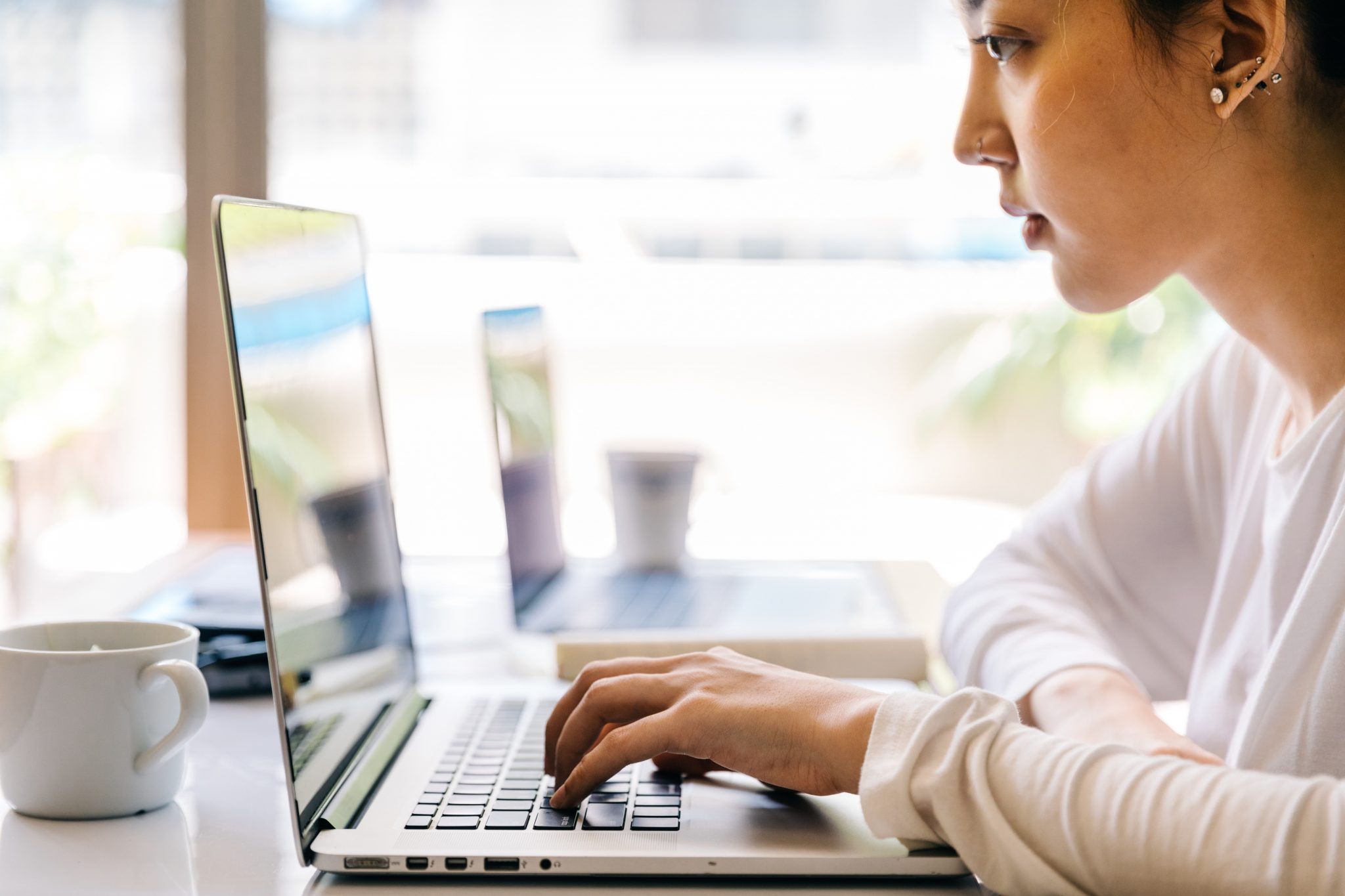 Woman on a laptop in a cafe