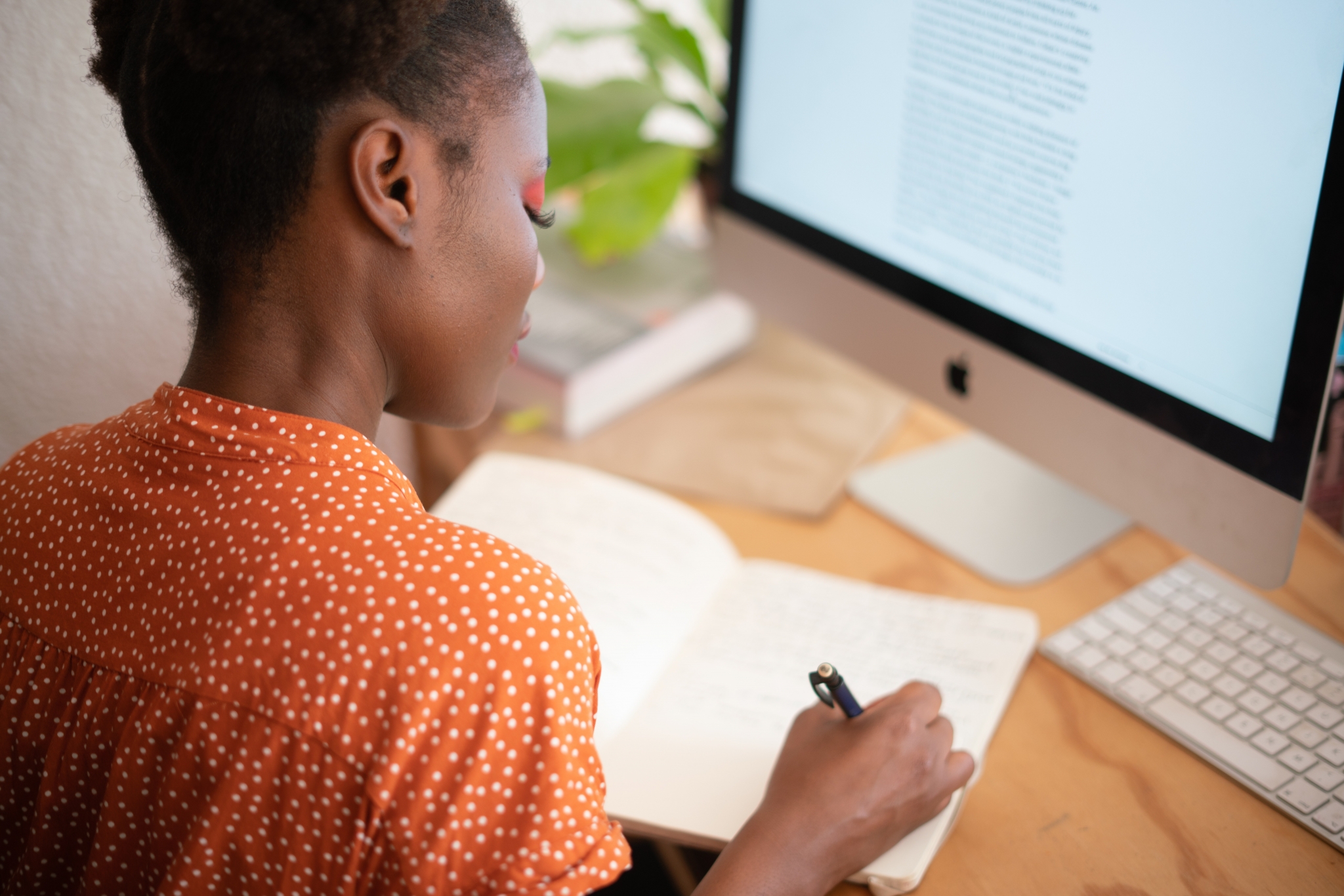 African-American woman studying on the computer