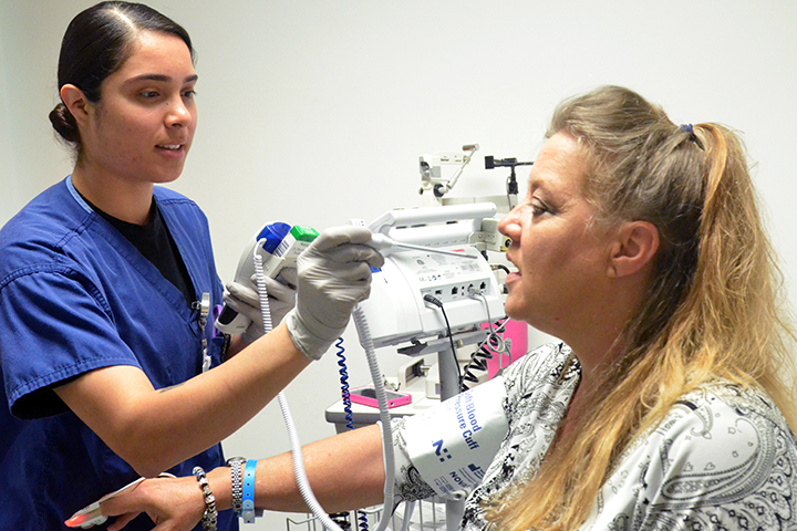Female nurse taking a patient's vital signs