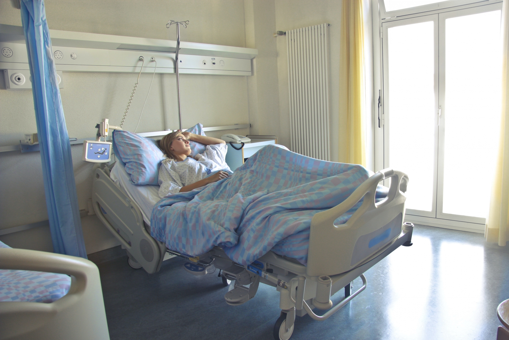 Female patient lying in a hospital bed