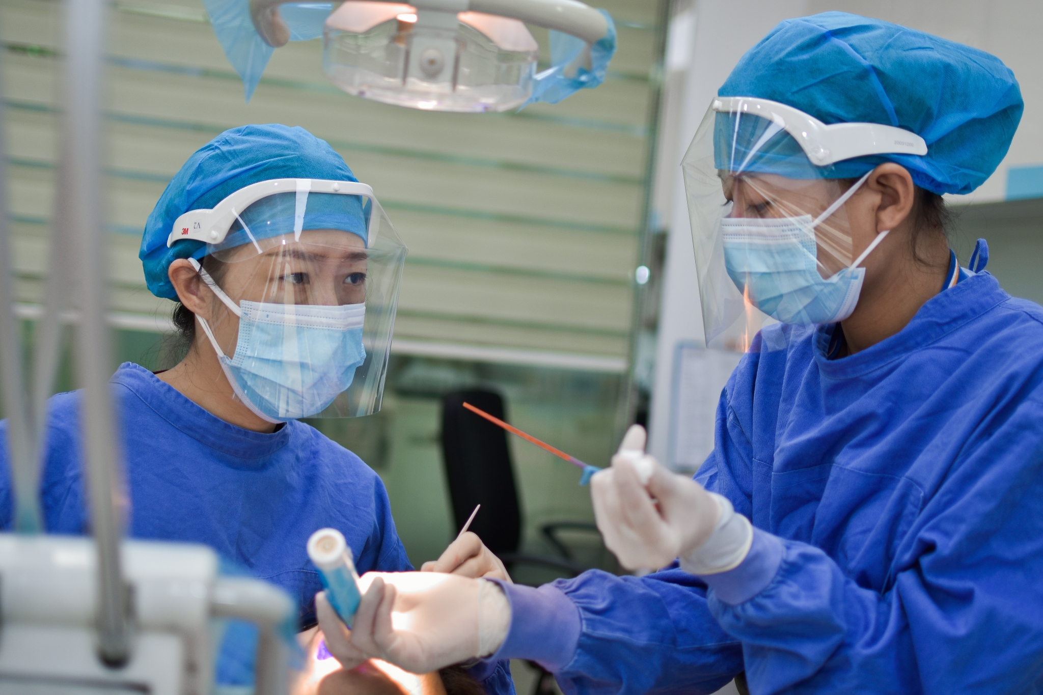 Two nurses in personal protective equipment