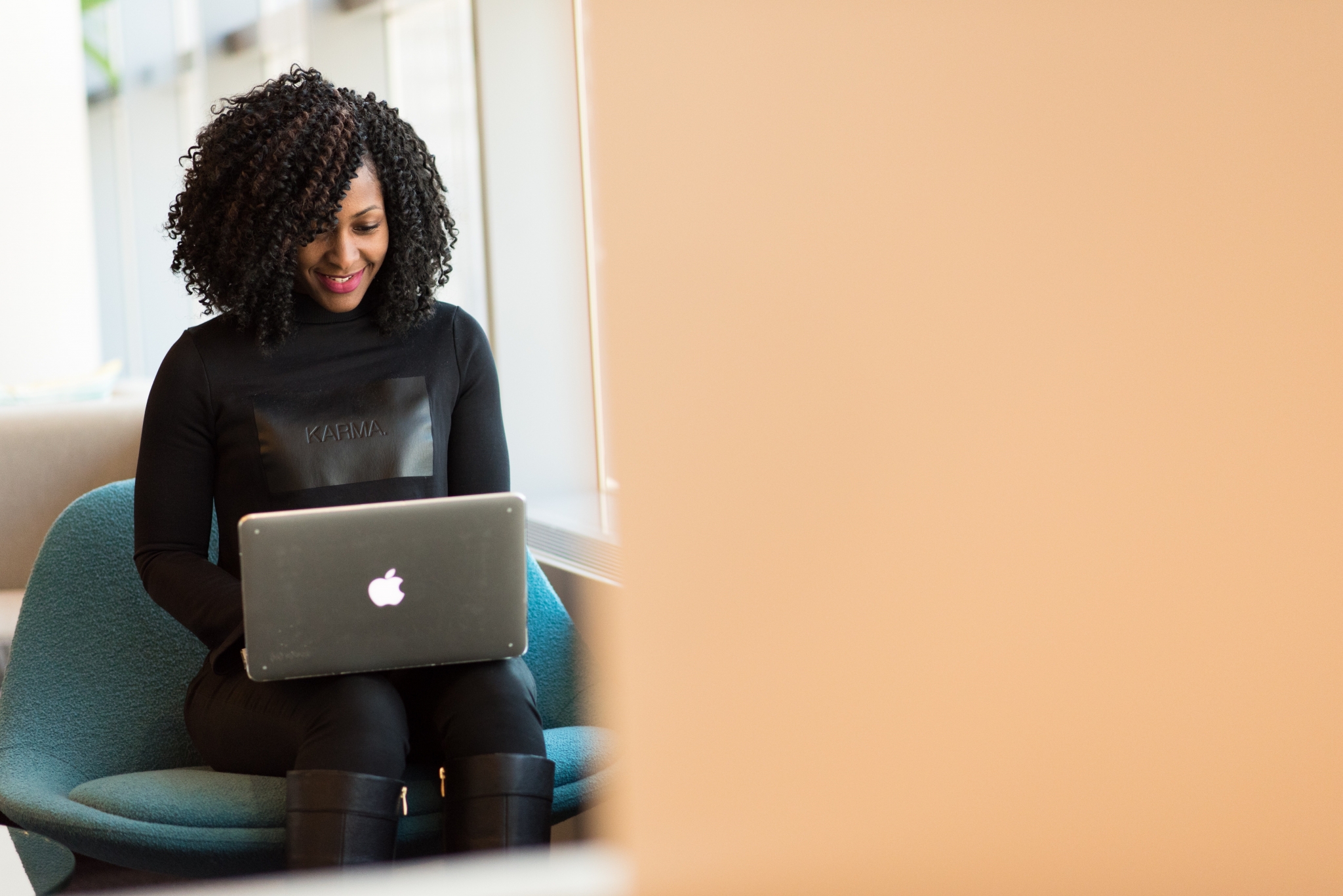 Smiling woman on a laptop