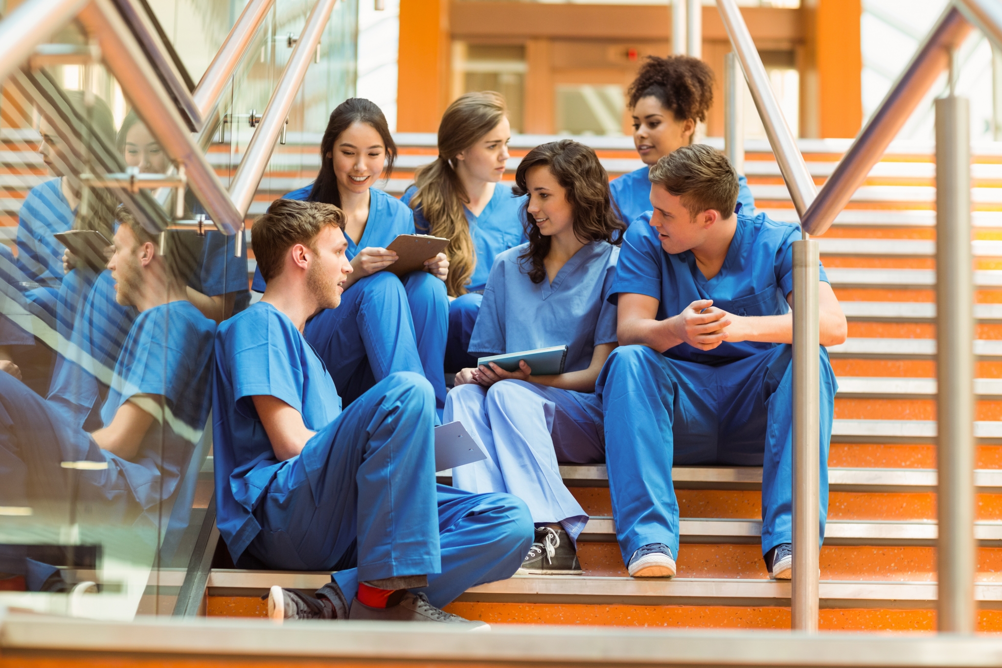 Group of medical students sitting on steps