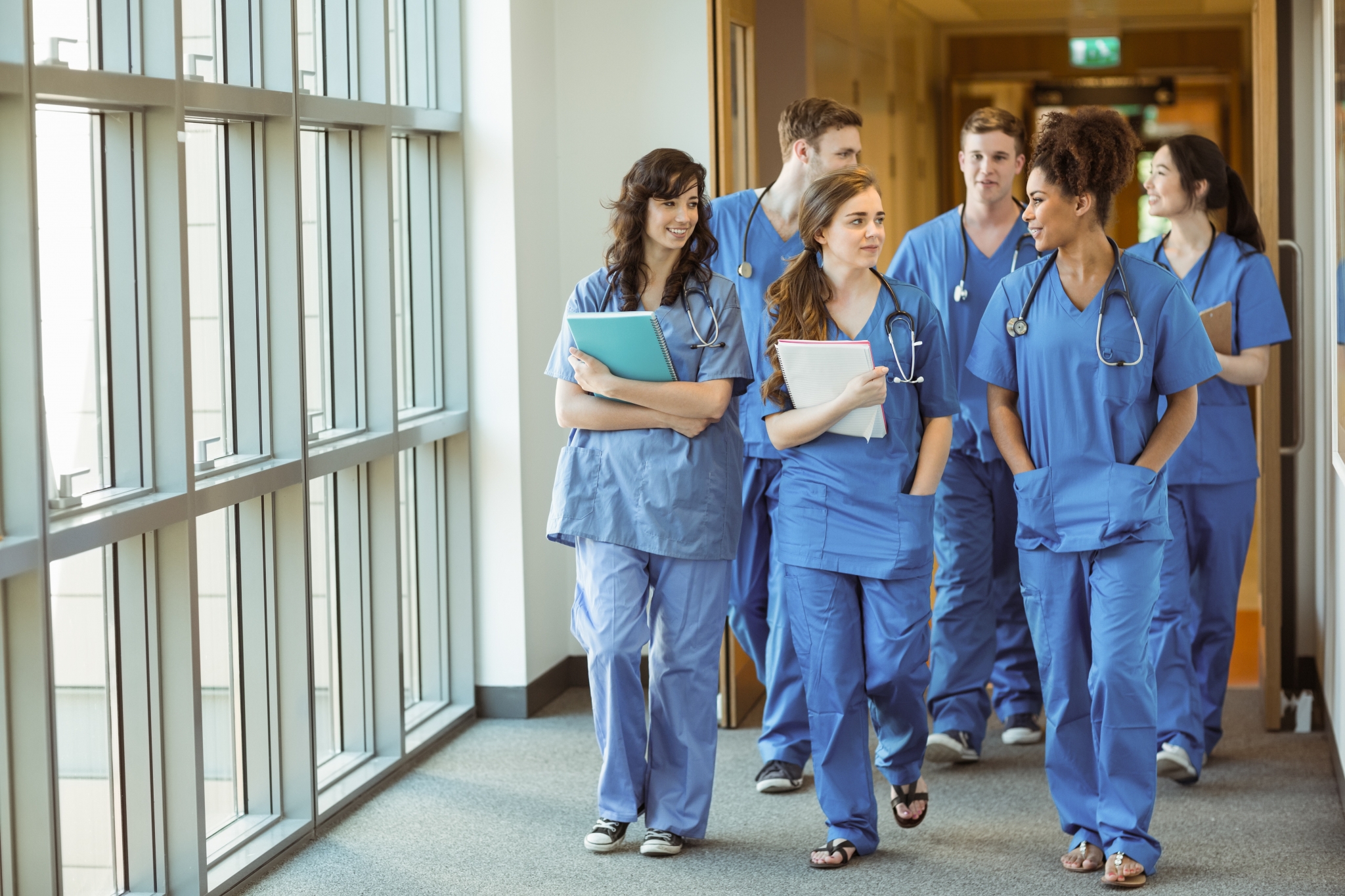 Medical students walking in a hallway