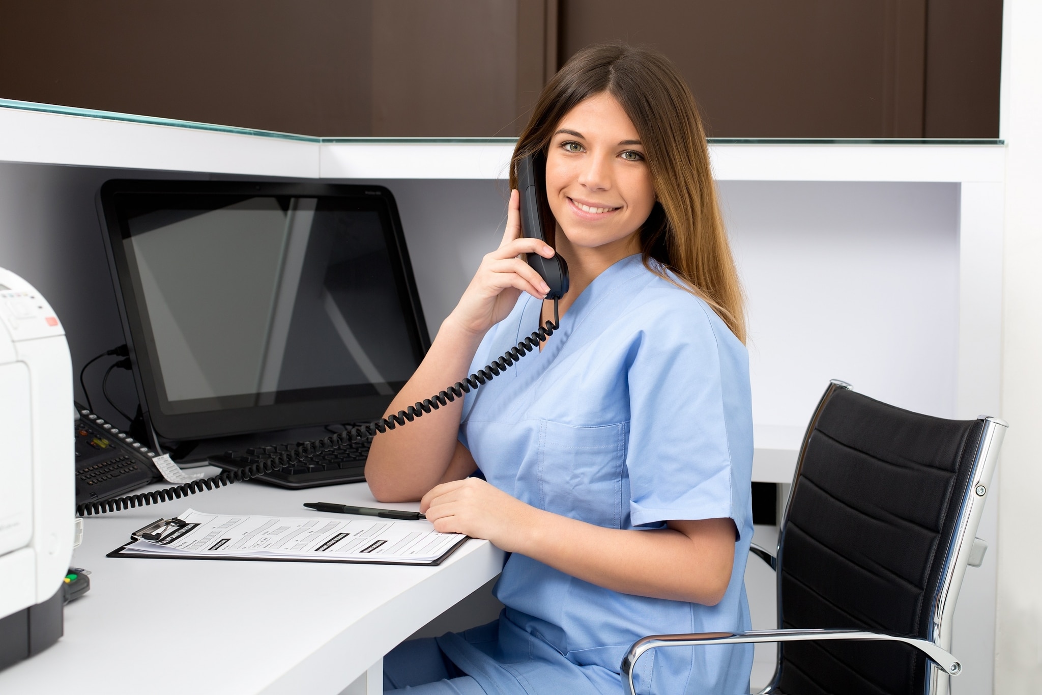 Medical receptionist on the phone