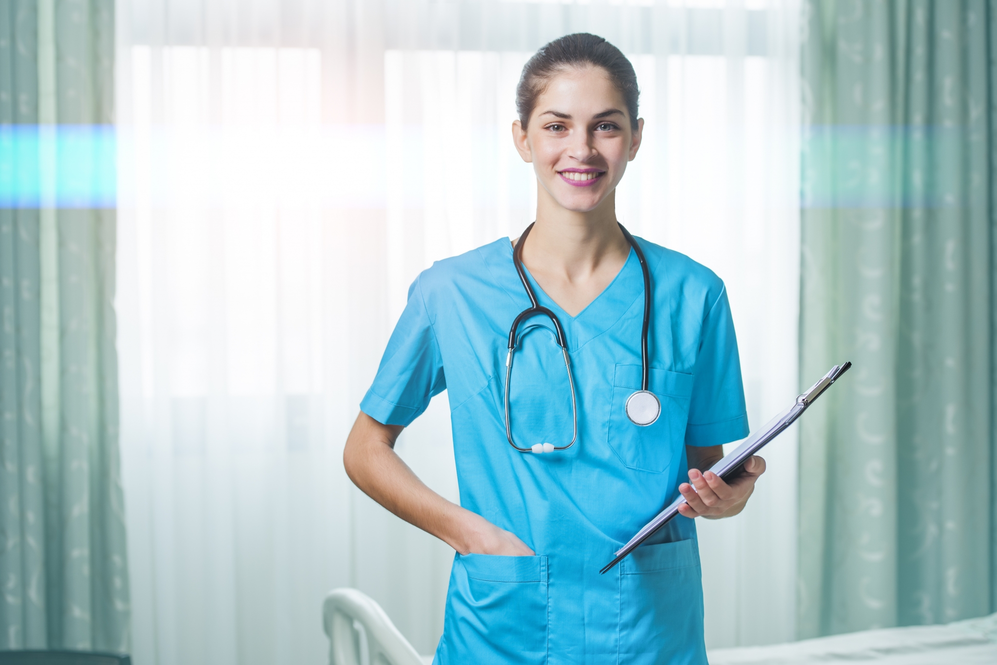 Smiling female nurse with a chart