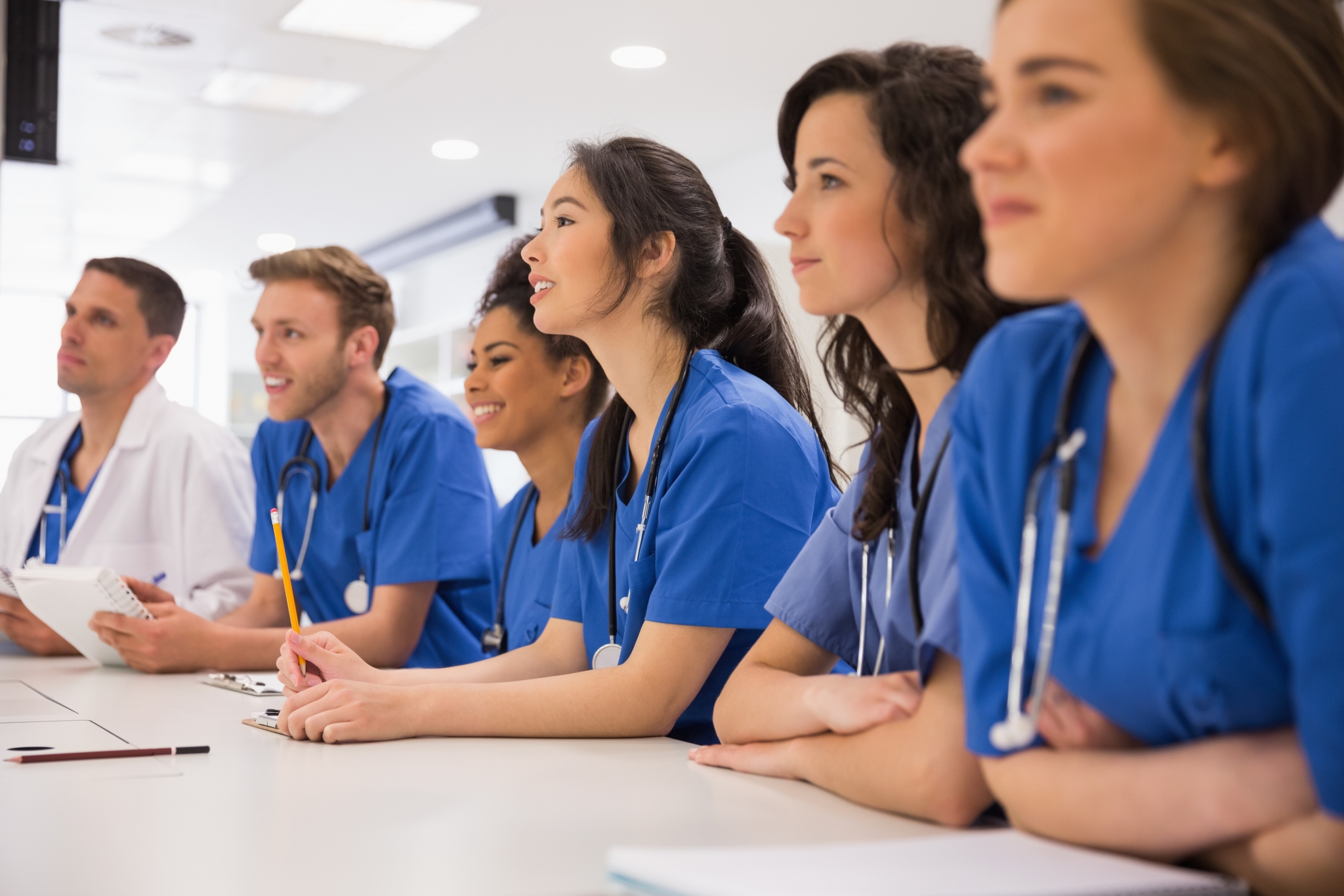 Team of medical students taking notes
