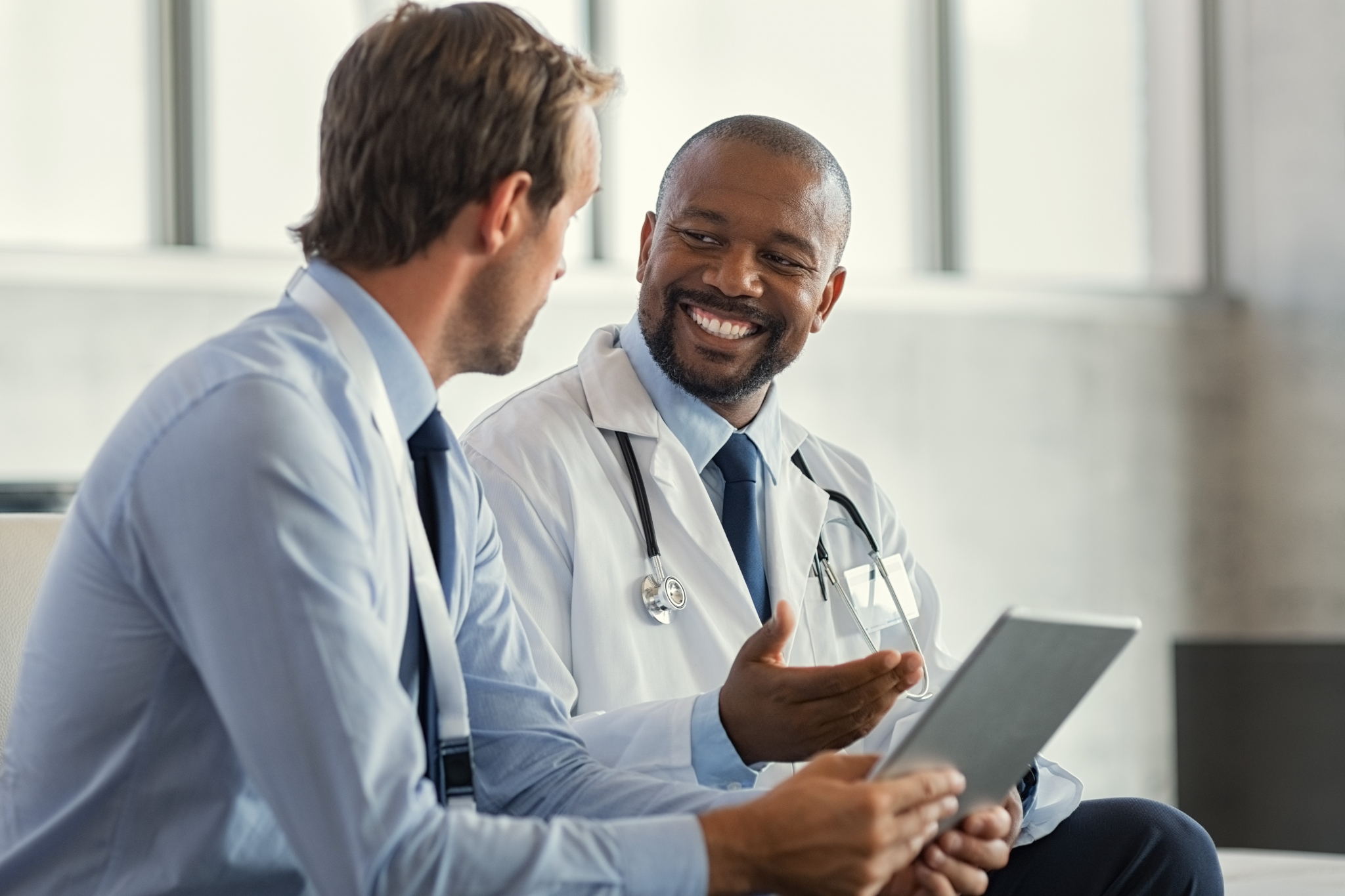 Two smiling medical professionals