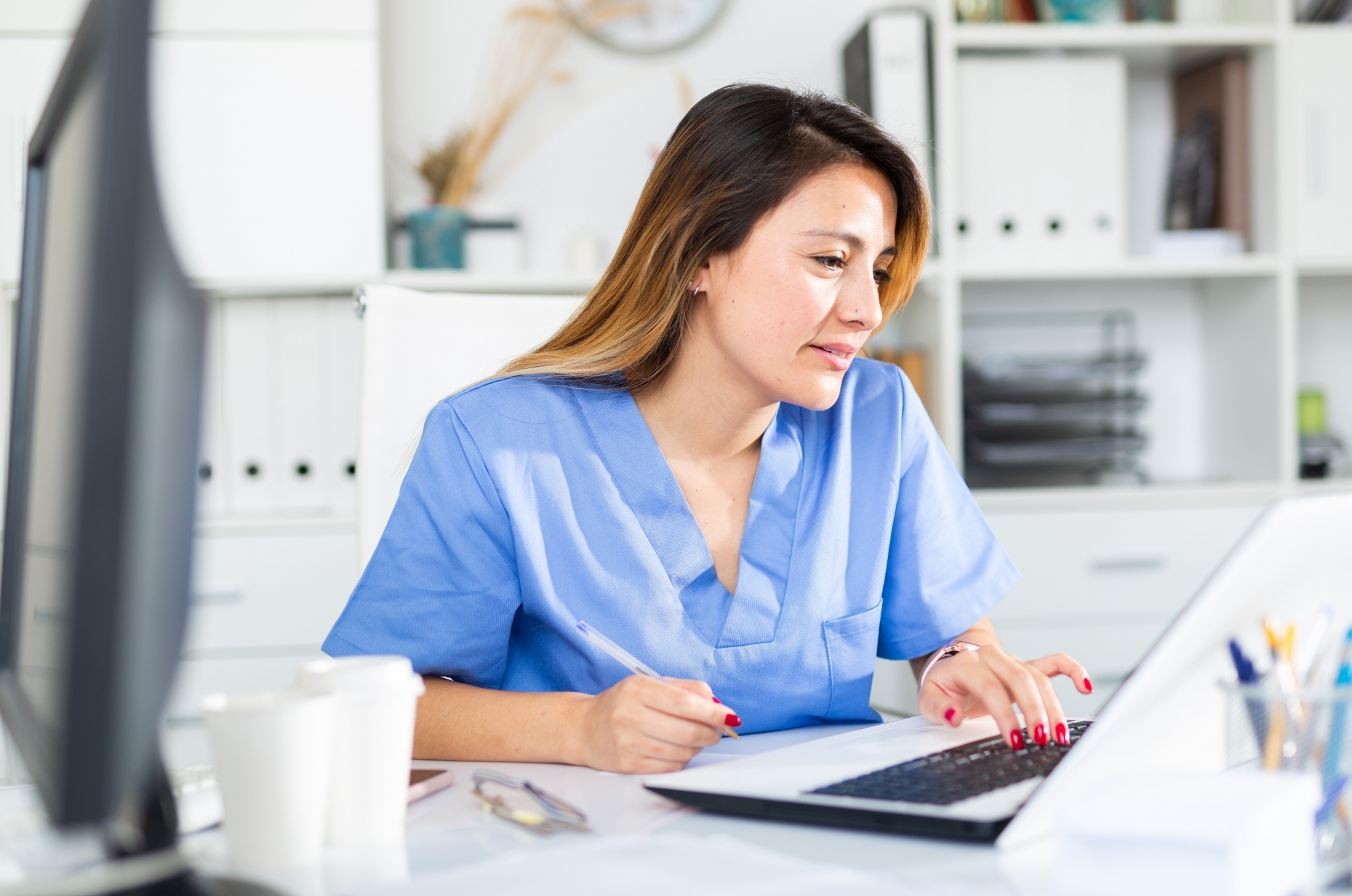 Healthcare worker on a laptop