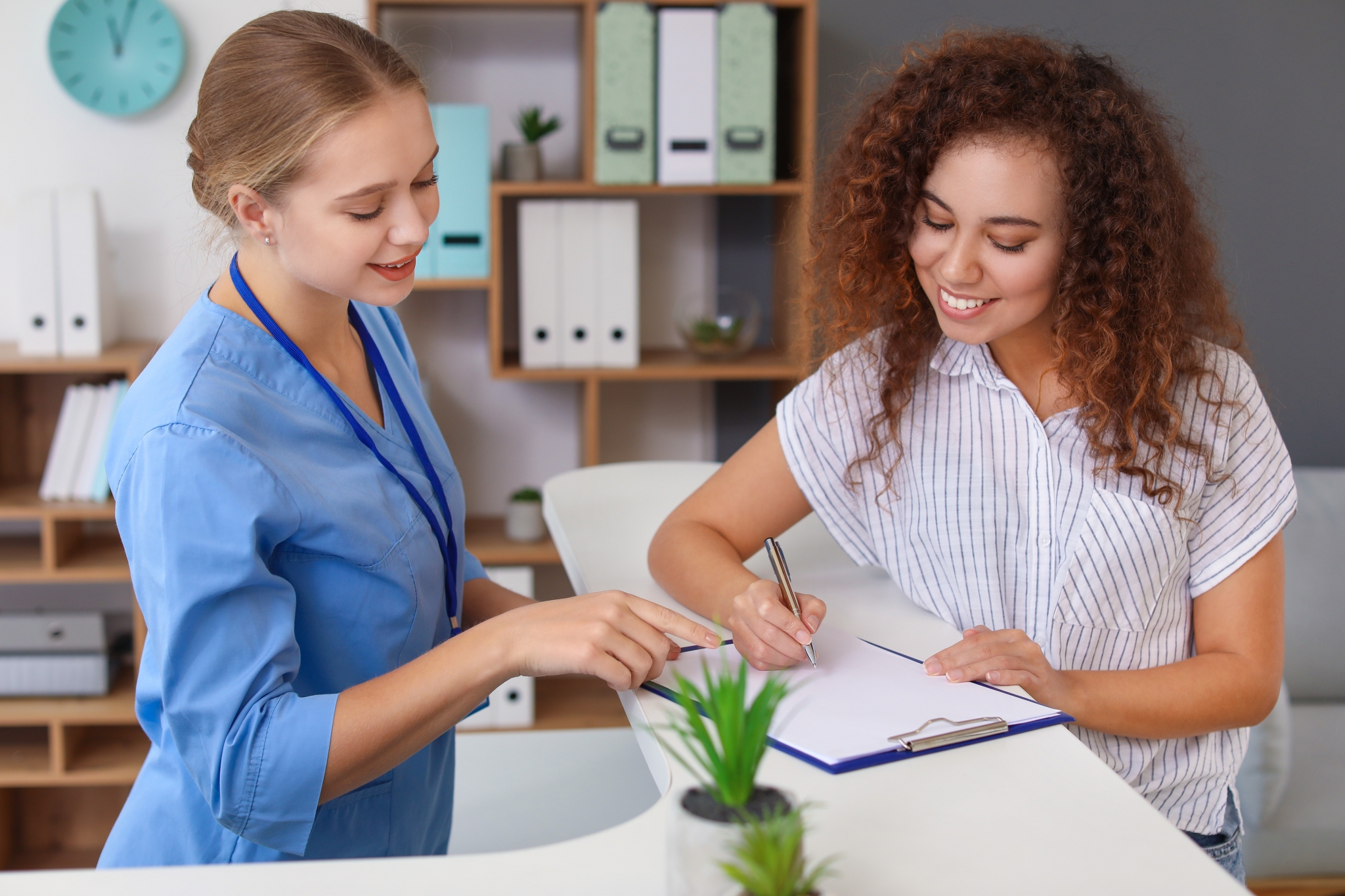 Medical Assistant assisting a patient