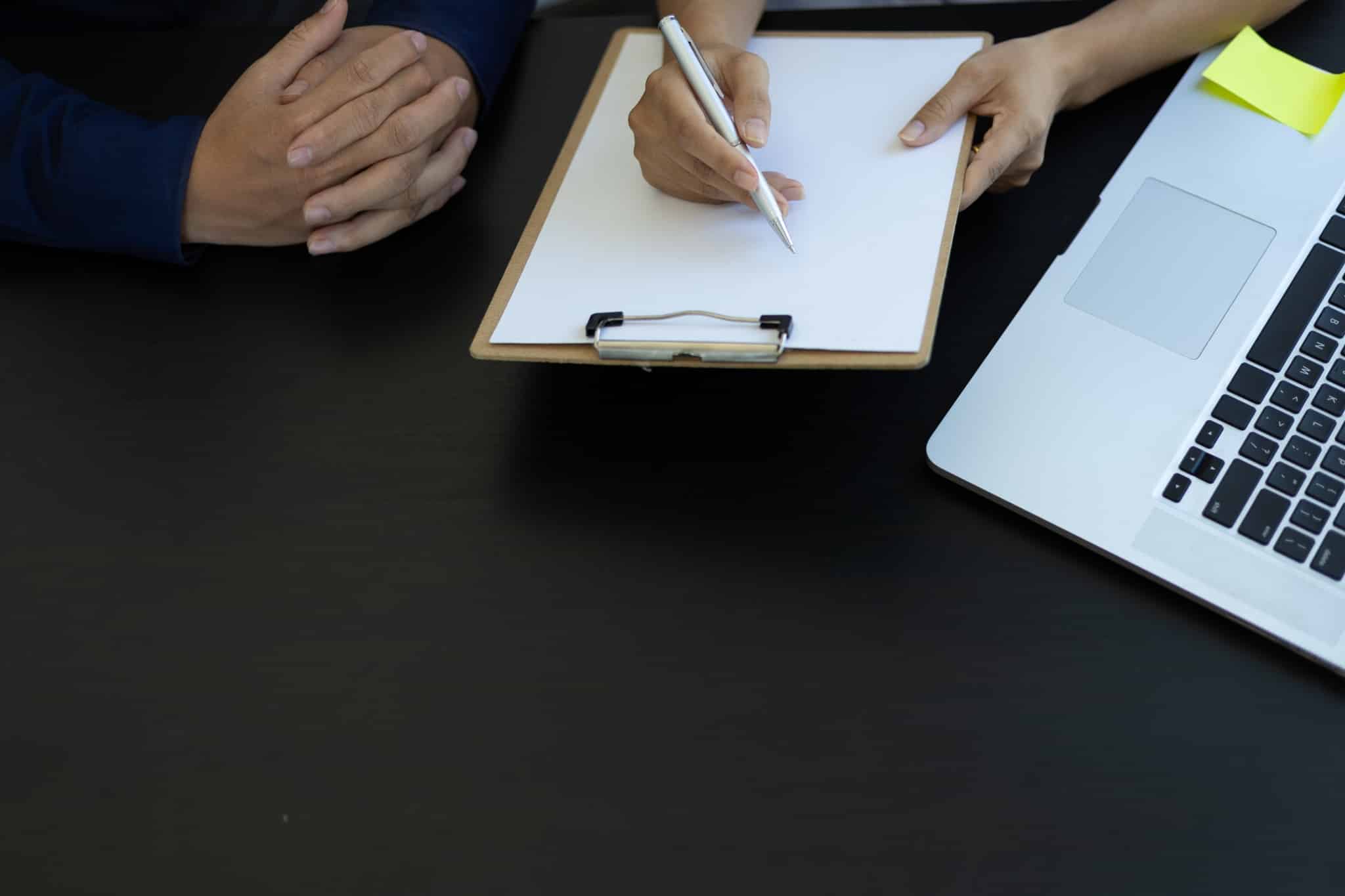 Healthcare professional filling out paperwork