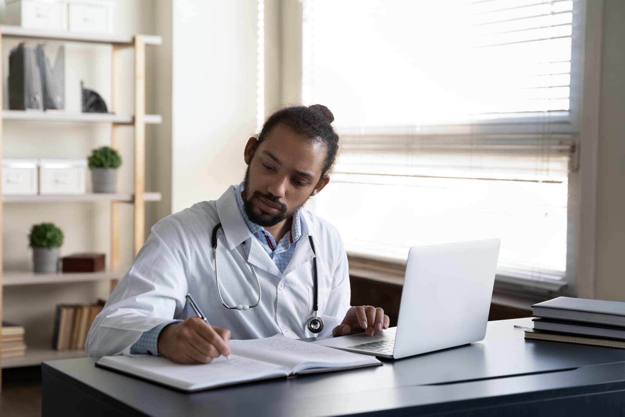 Medical professional taking notes