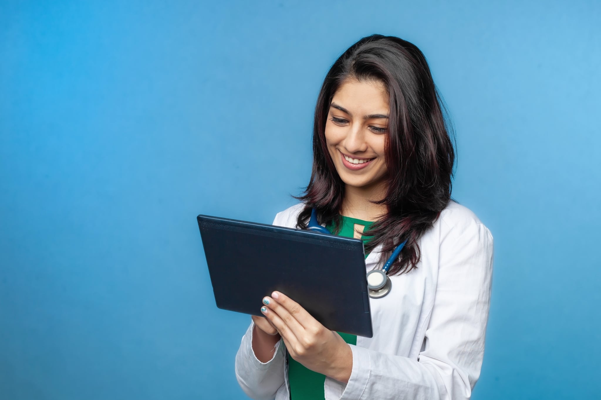 Young medical professional using a tablet