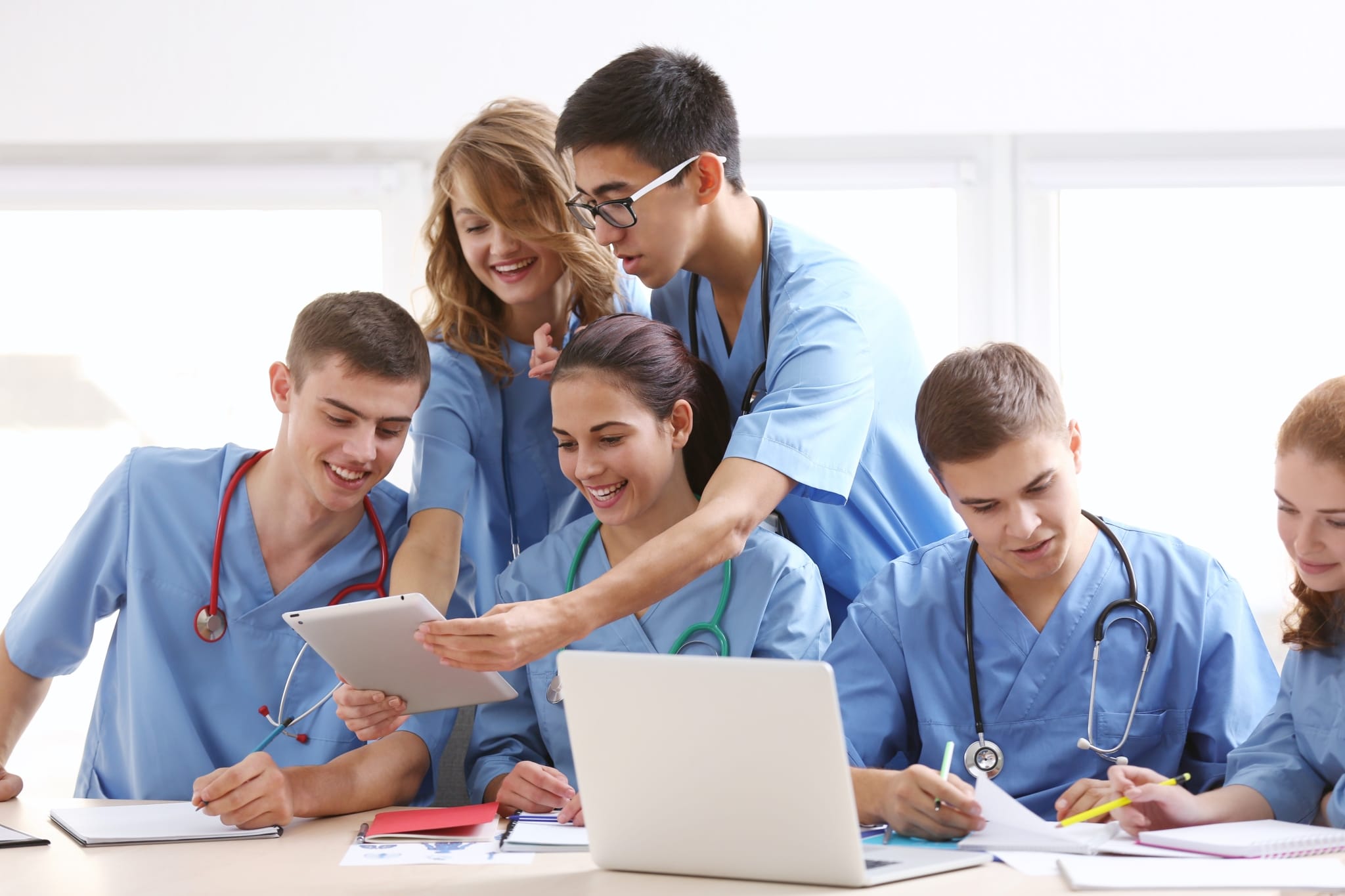 Group of medical students comparing notes
