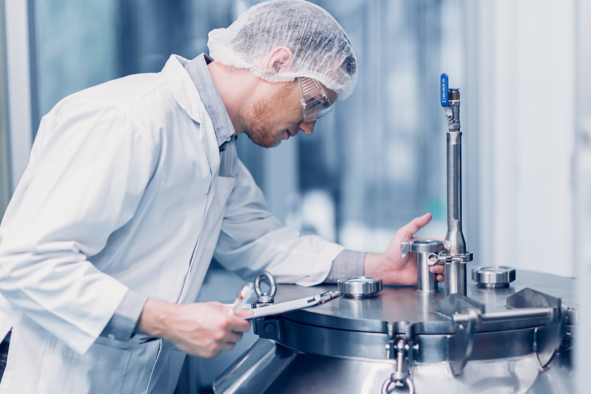 Medical technician examining equipment