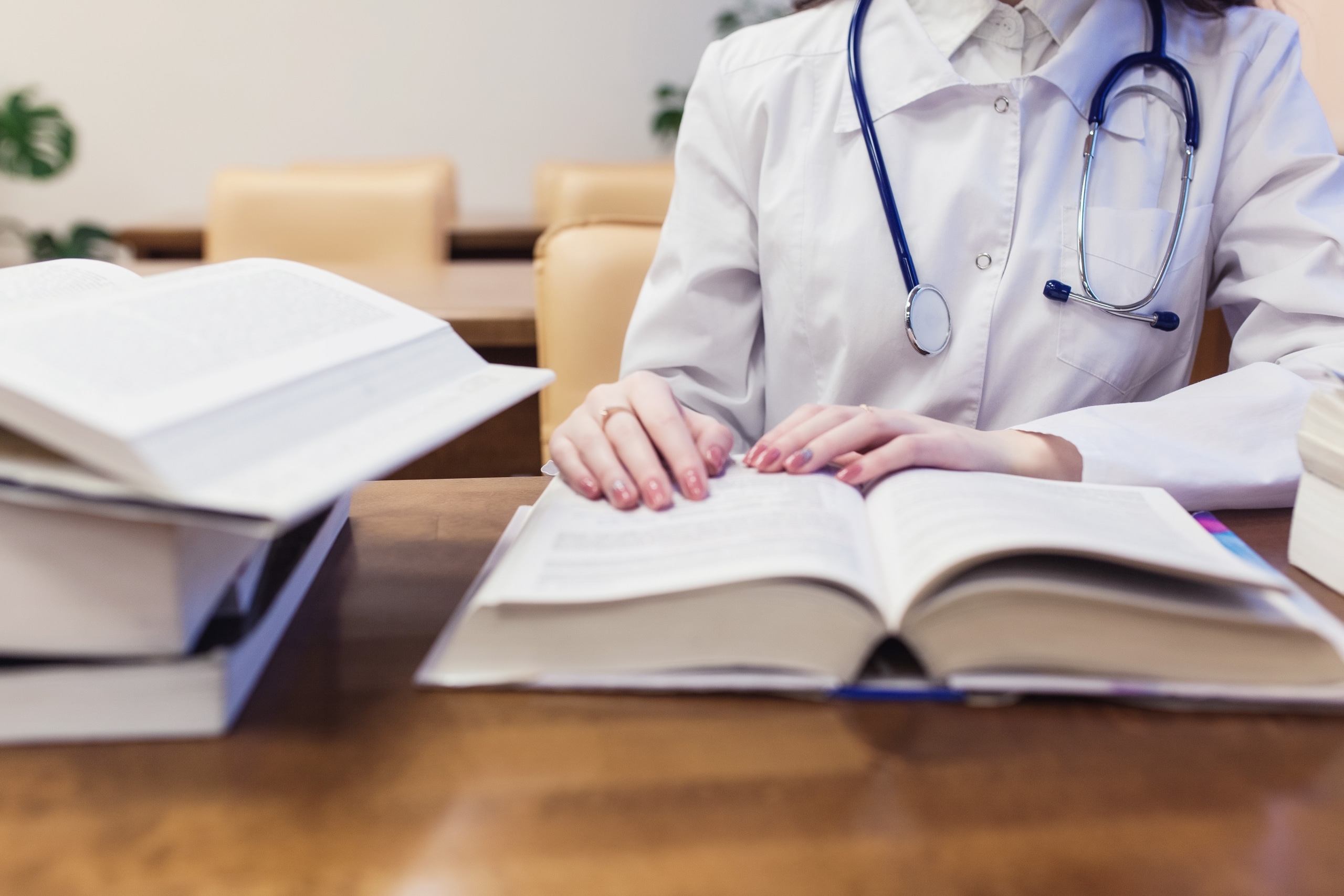 Medical student studying textbooks