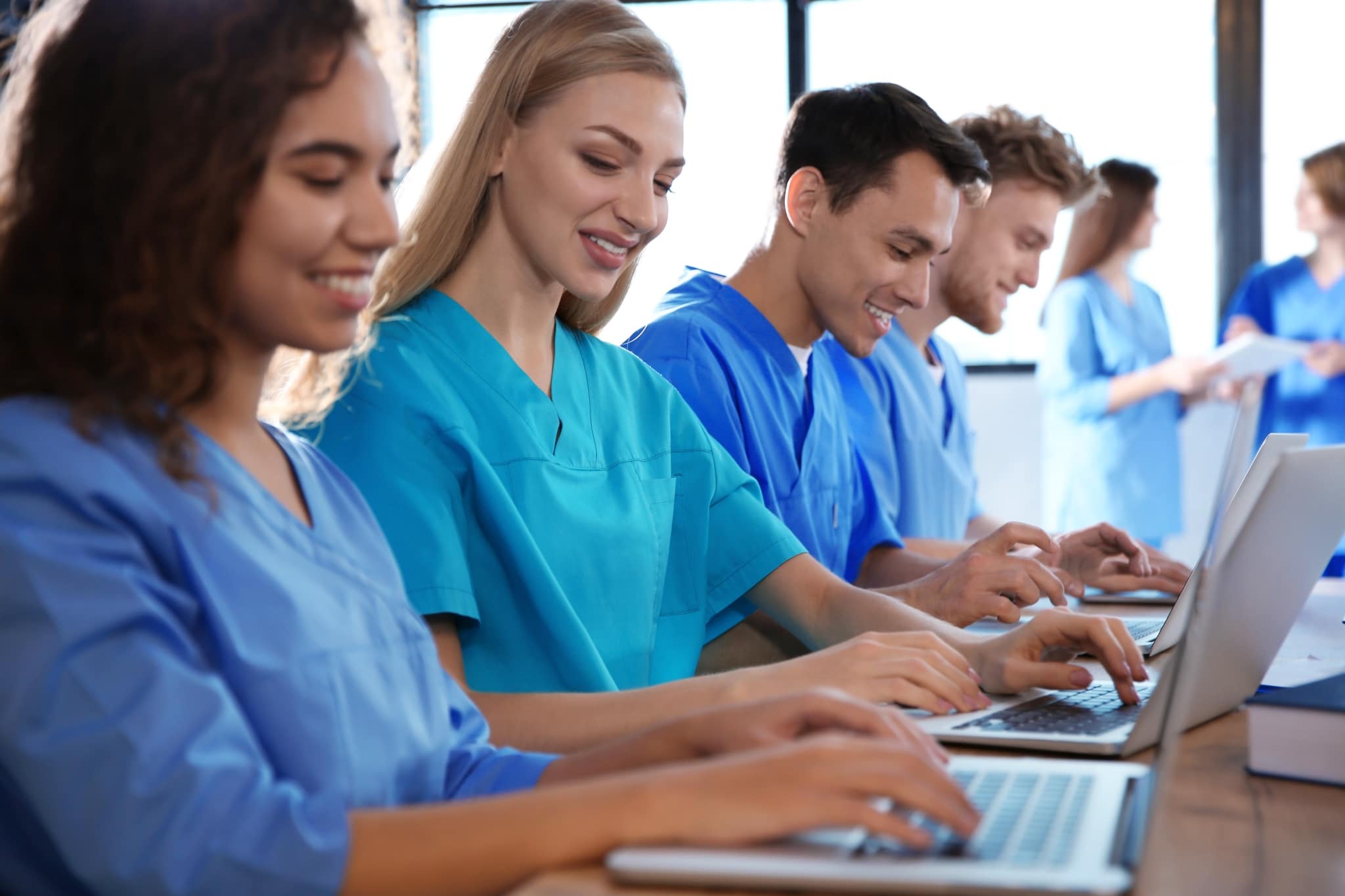 Group of medical students on laptops