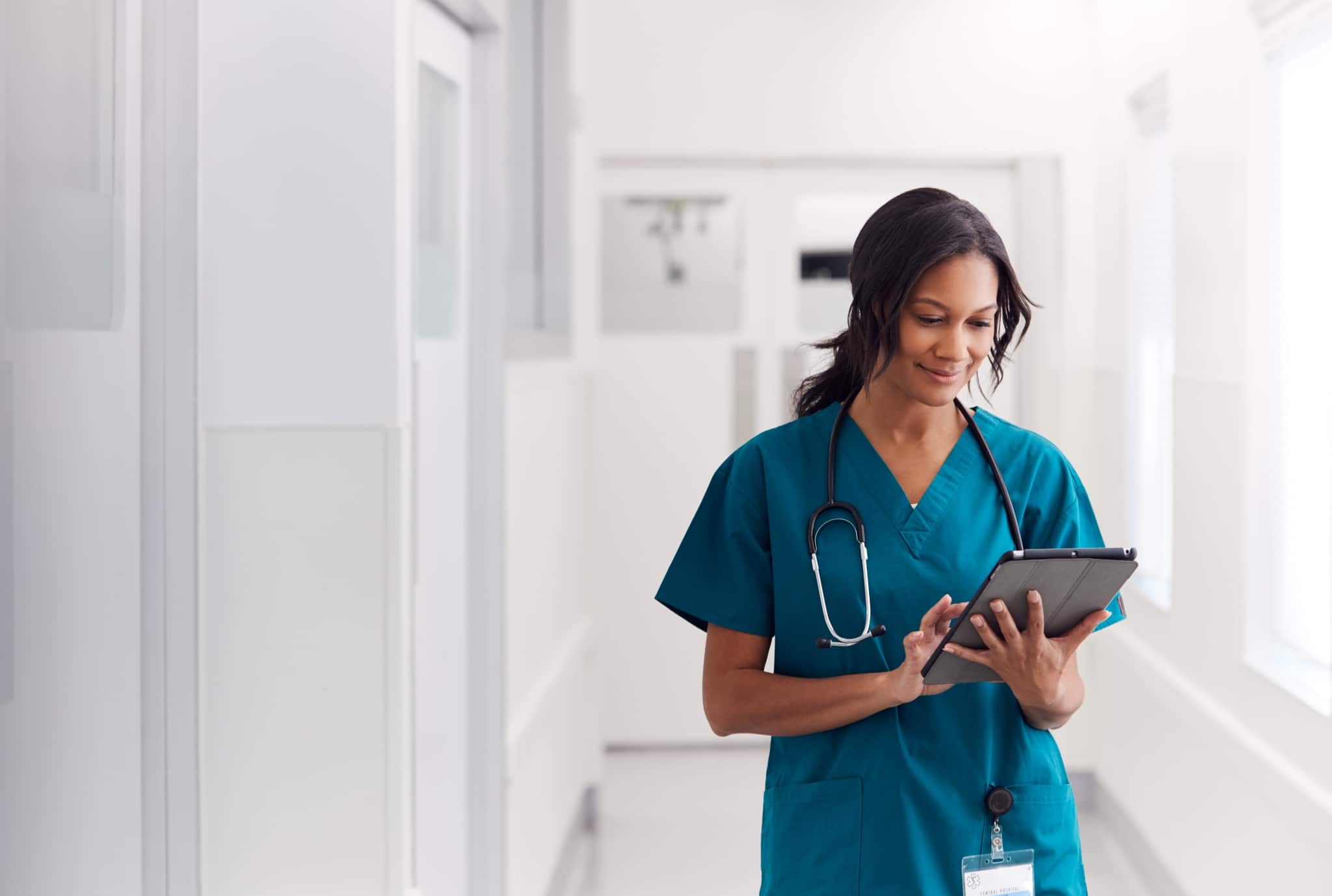 Female medical professional using a tablet