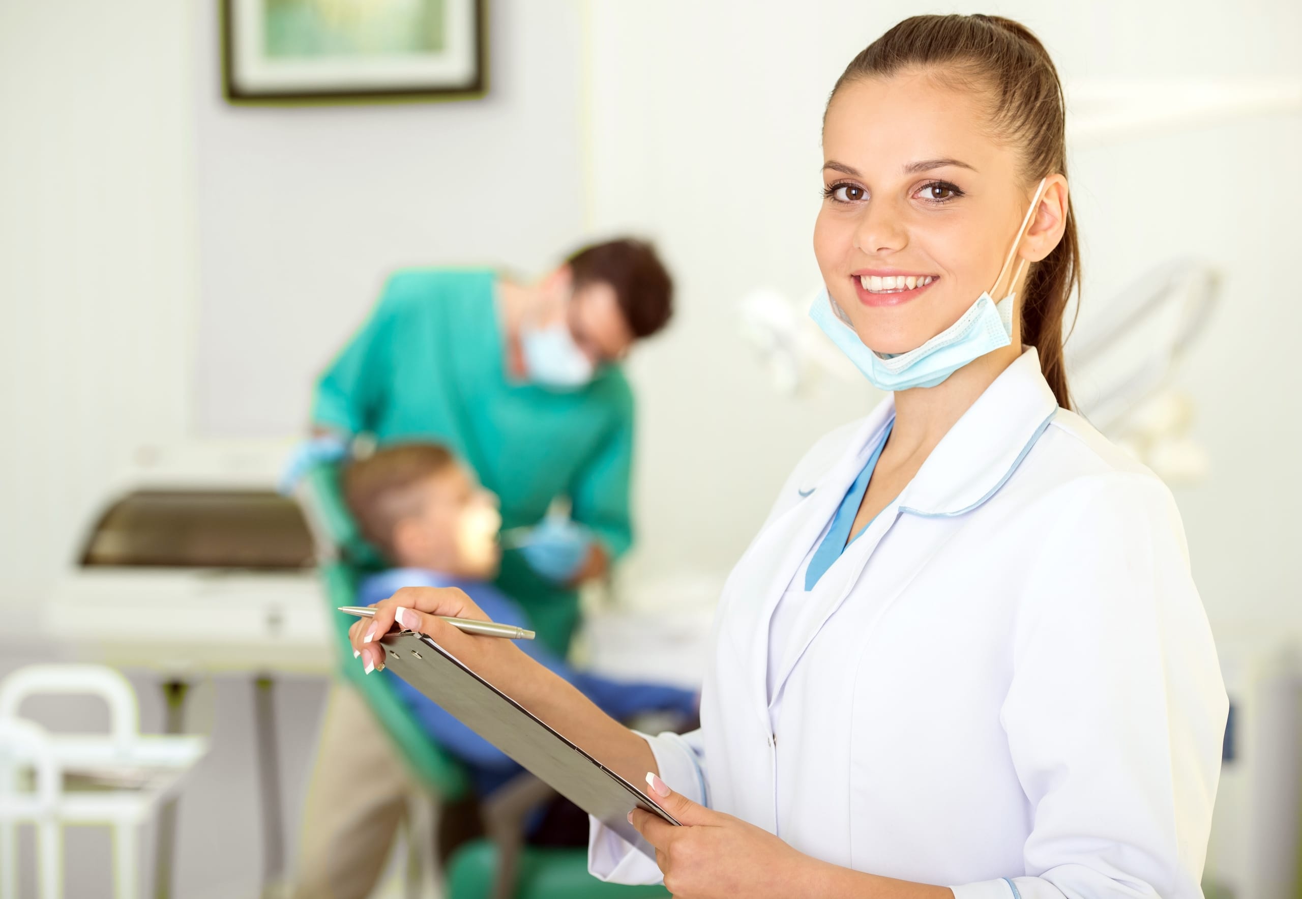 Close up of a Dental Assistant with a clipboard
