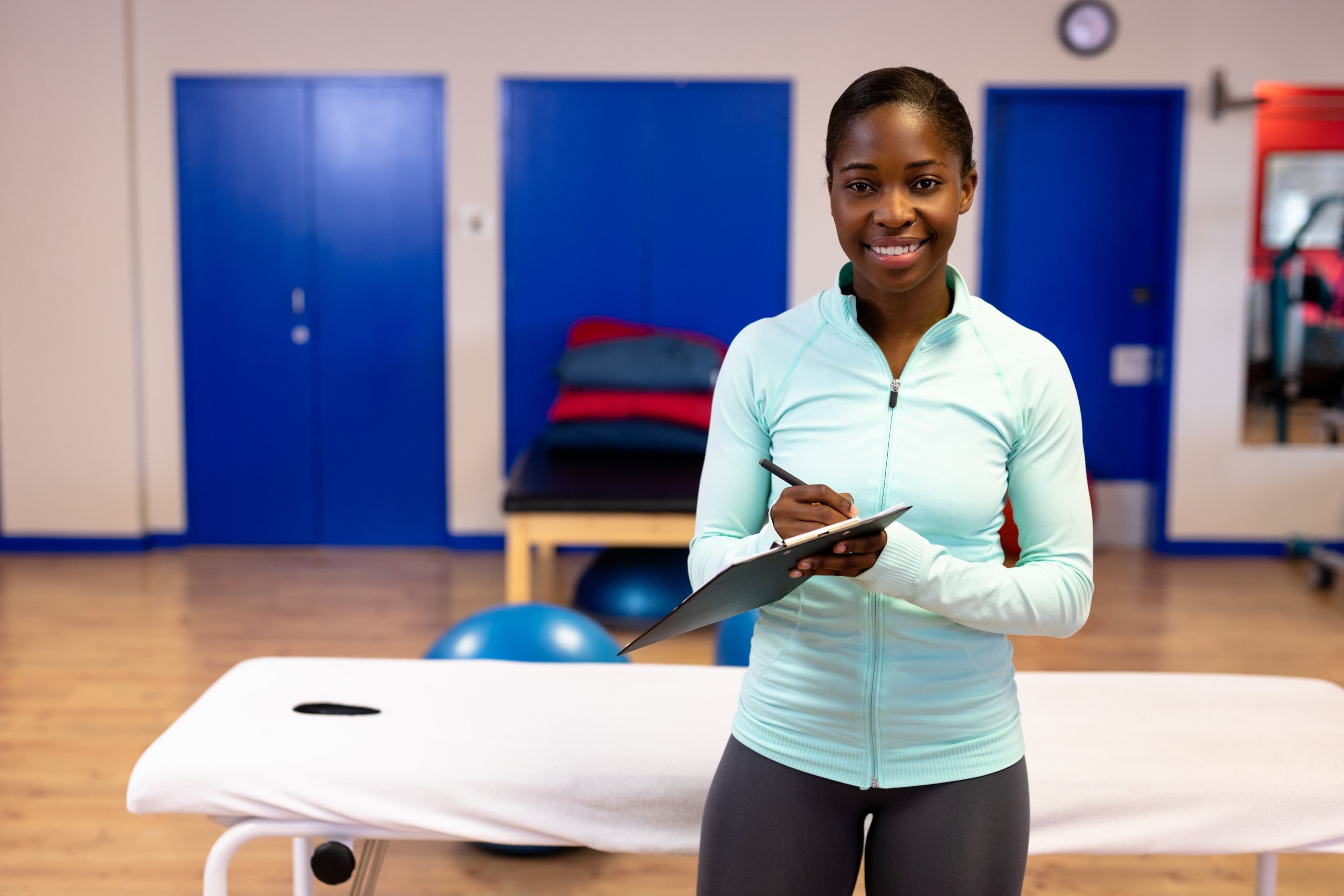 Happy female trainer looking at the camera