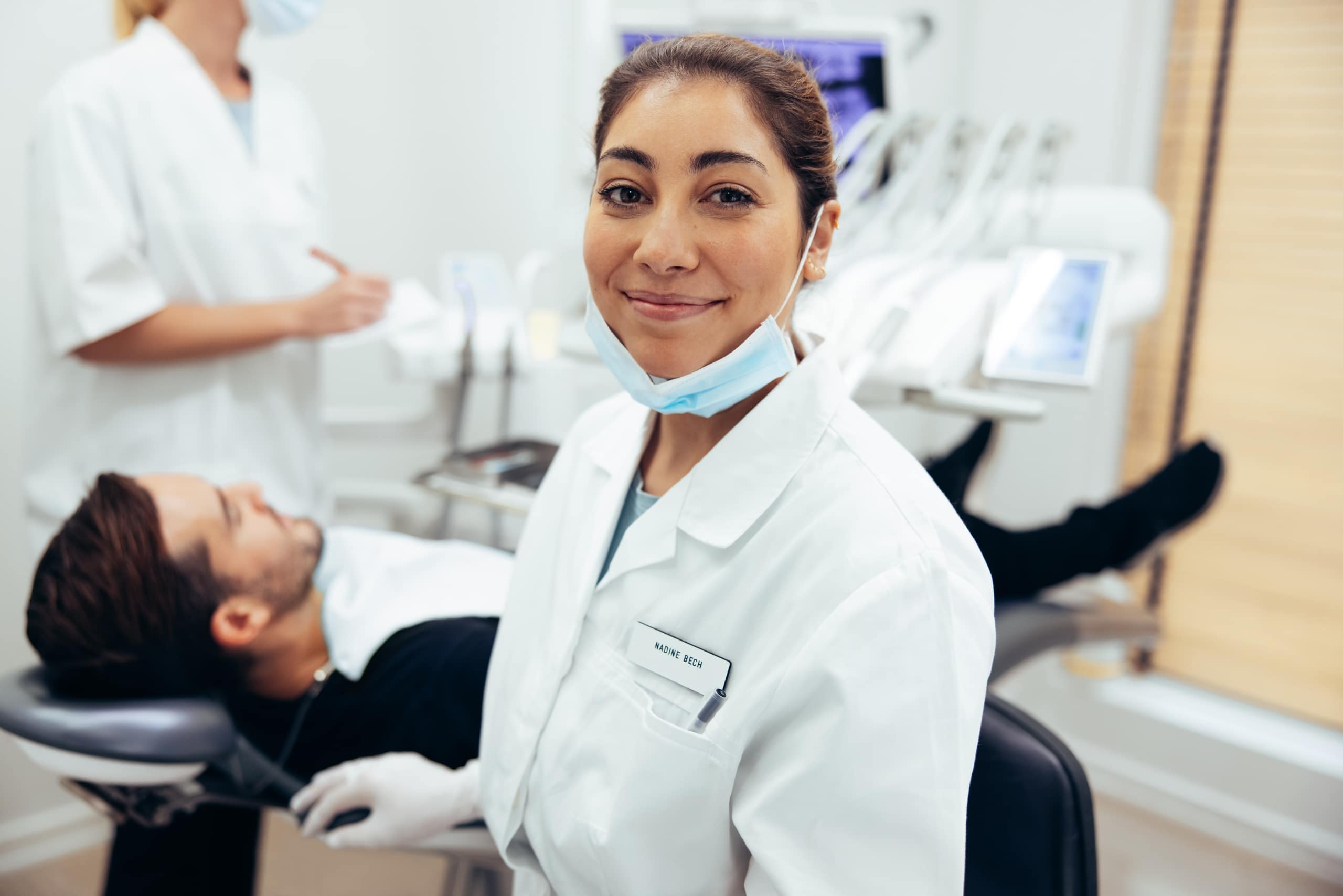 Female dental professional looking at the camera