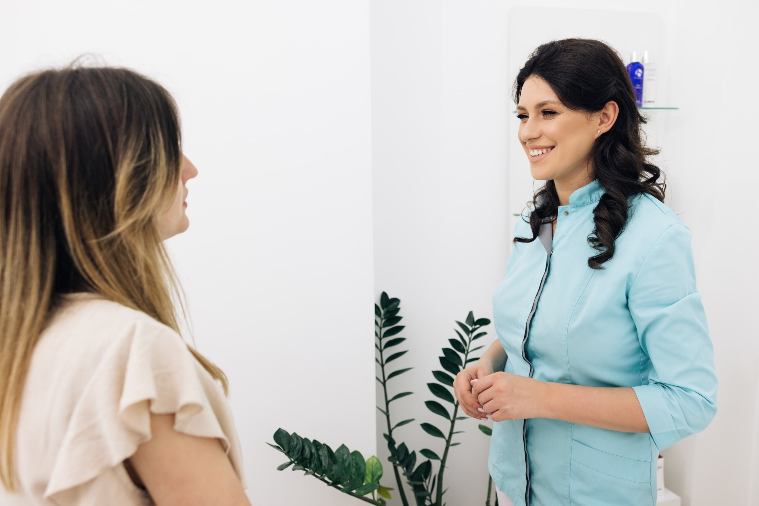 Smiling medical professional with a female patient