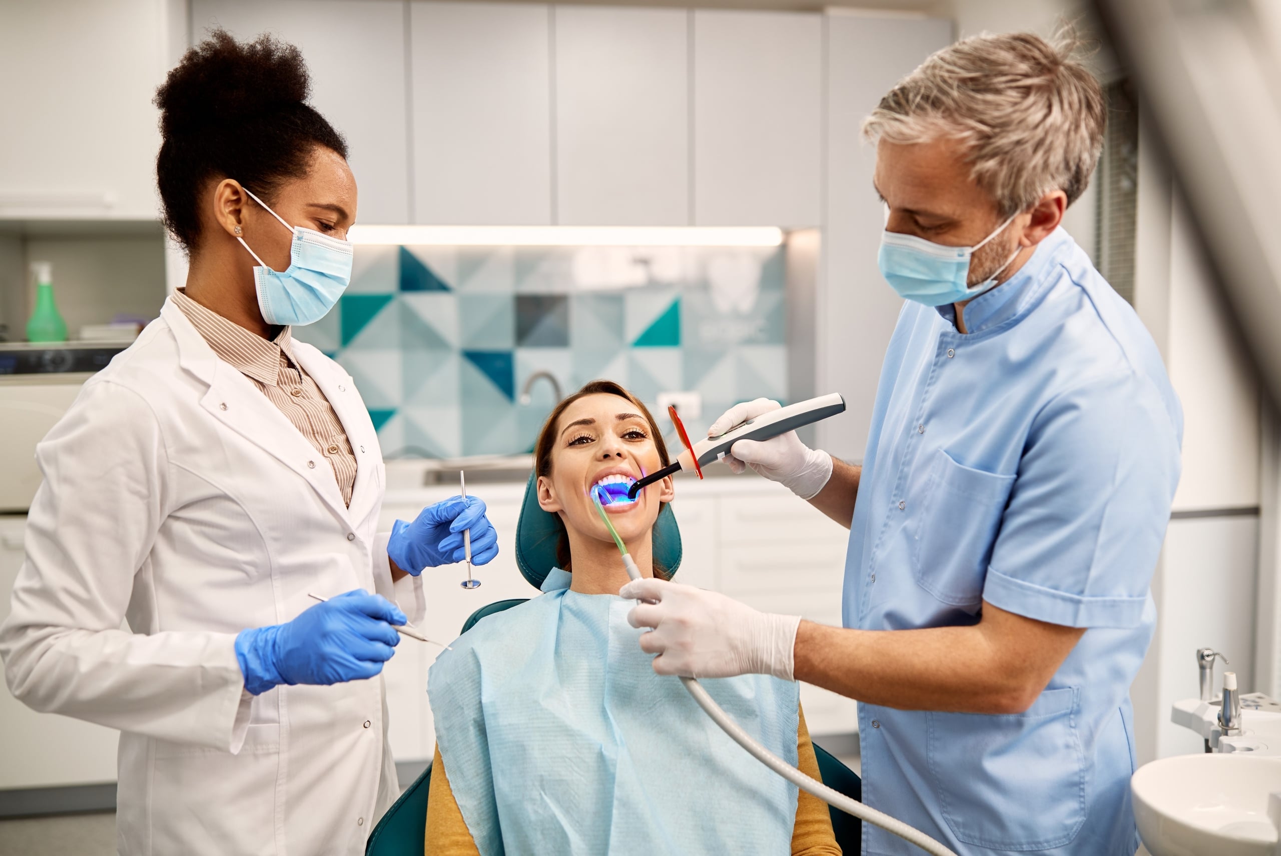 Dental team members with a patient