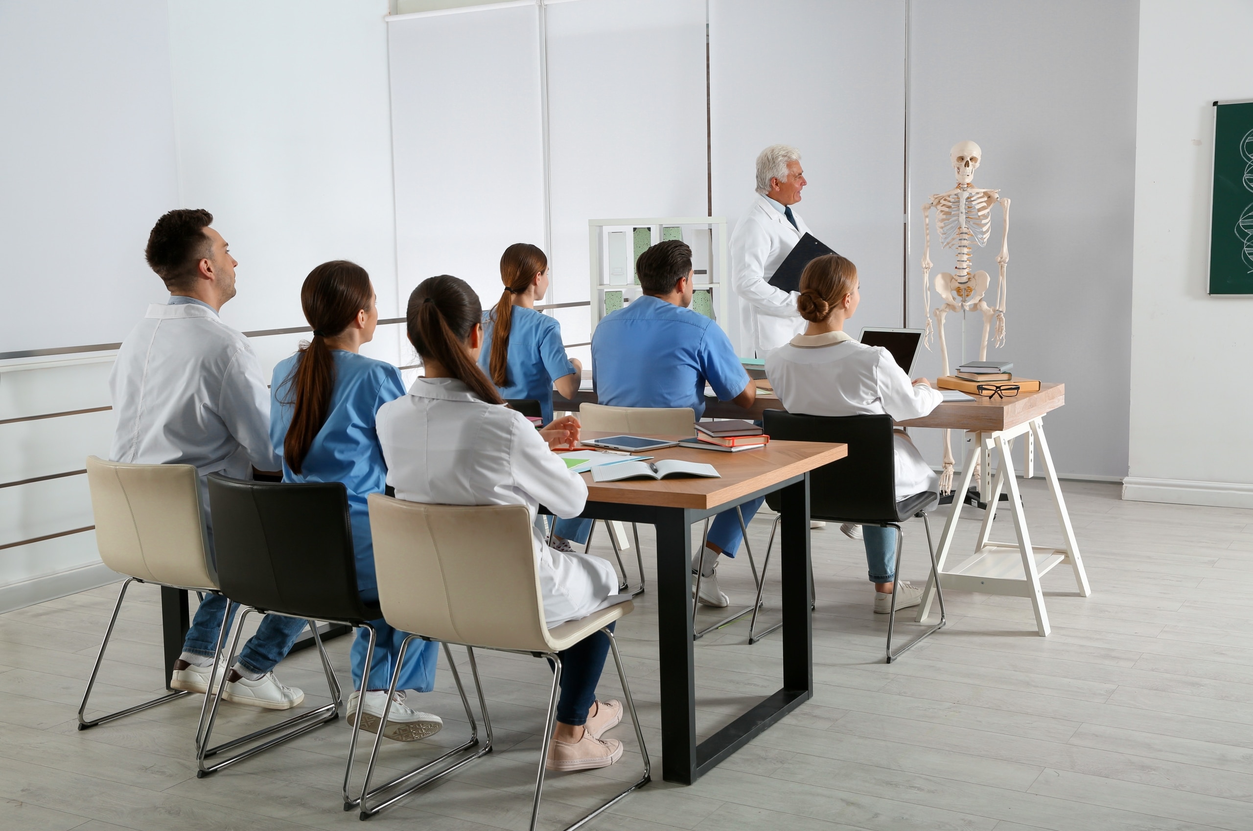 Medical students listening to their instructor