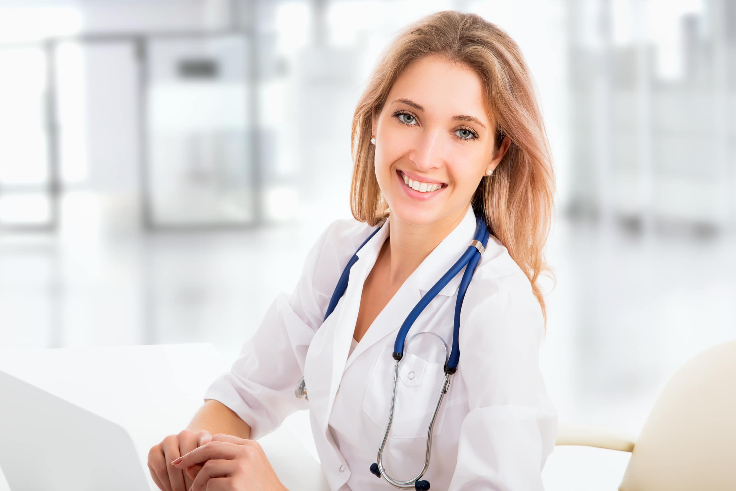 Medical professional wearing a white coat and stethoscope