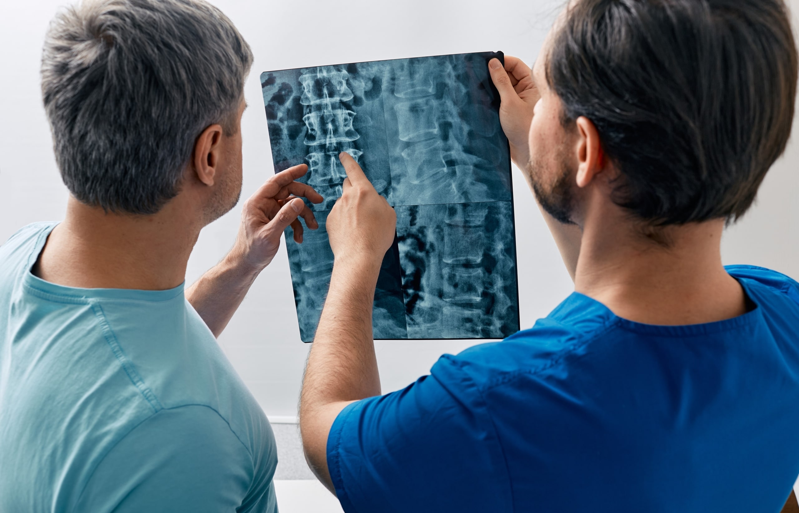 Two medical professionals looking at an X-ray