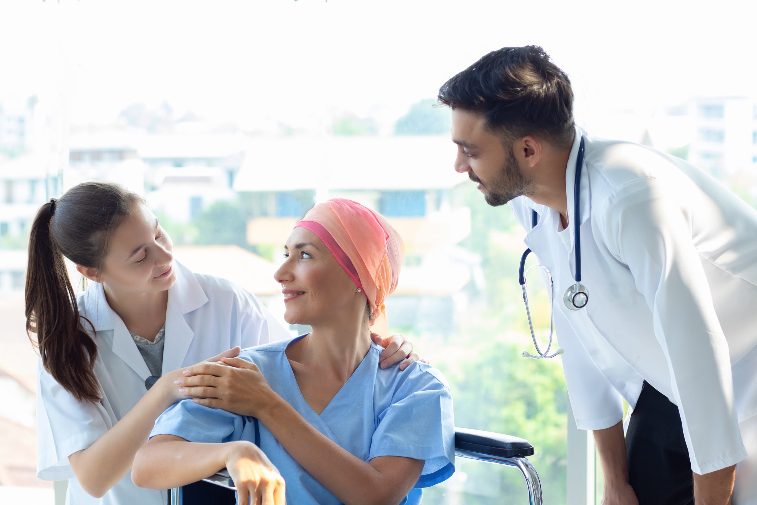 Group of healthcare professionals with a terminally ill patient