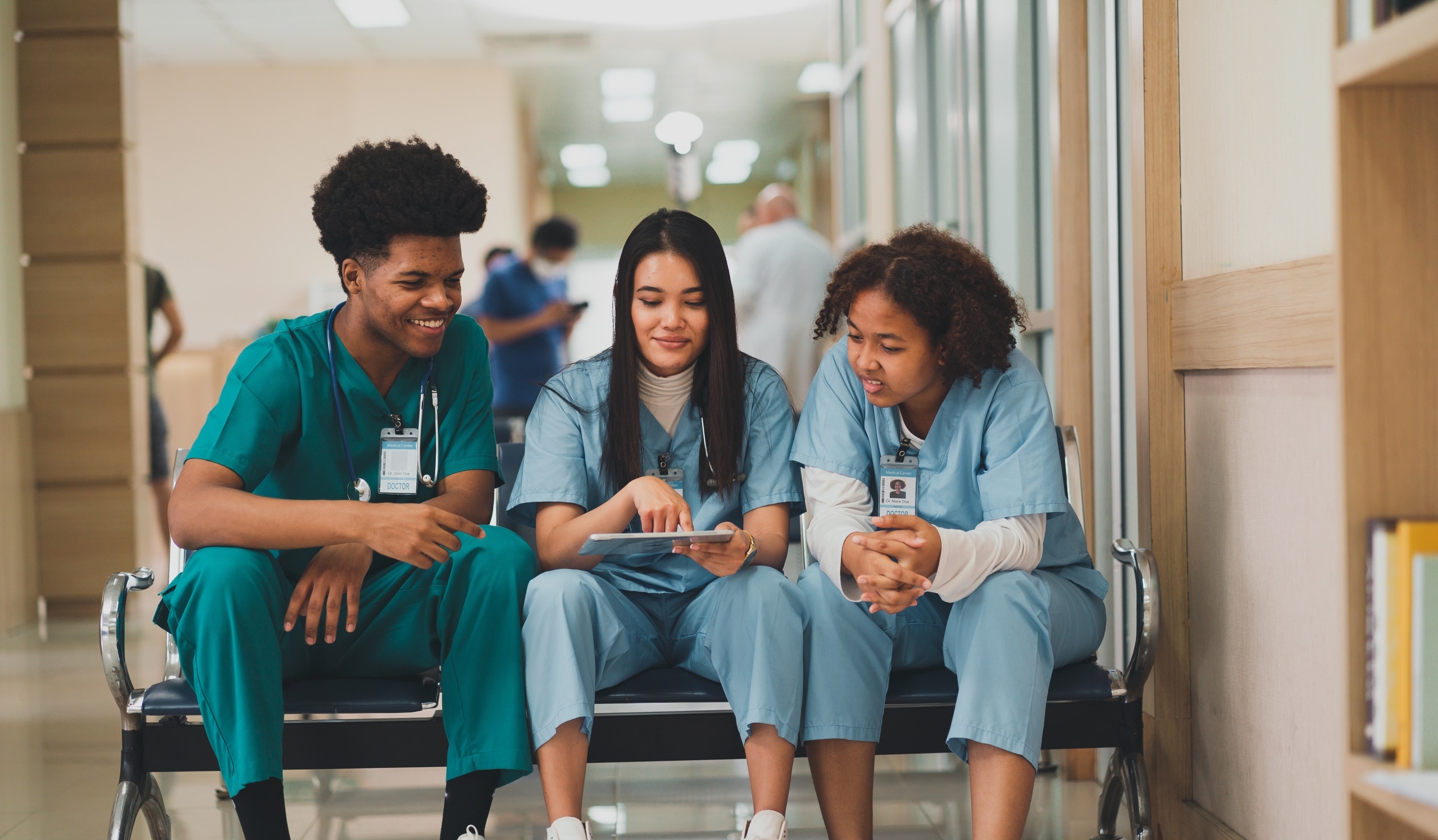 Diverse group of medical students looking at a tablet