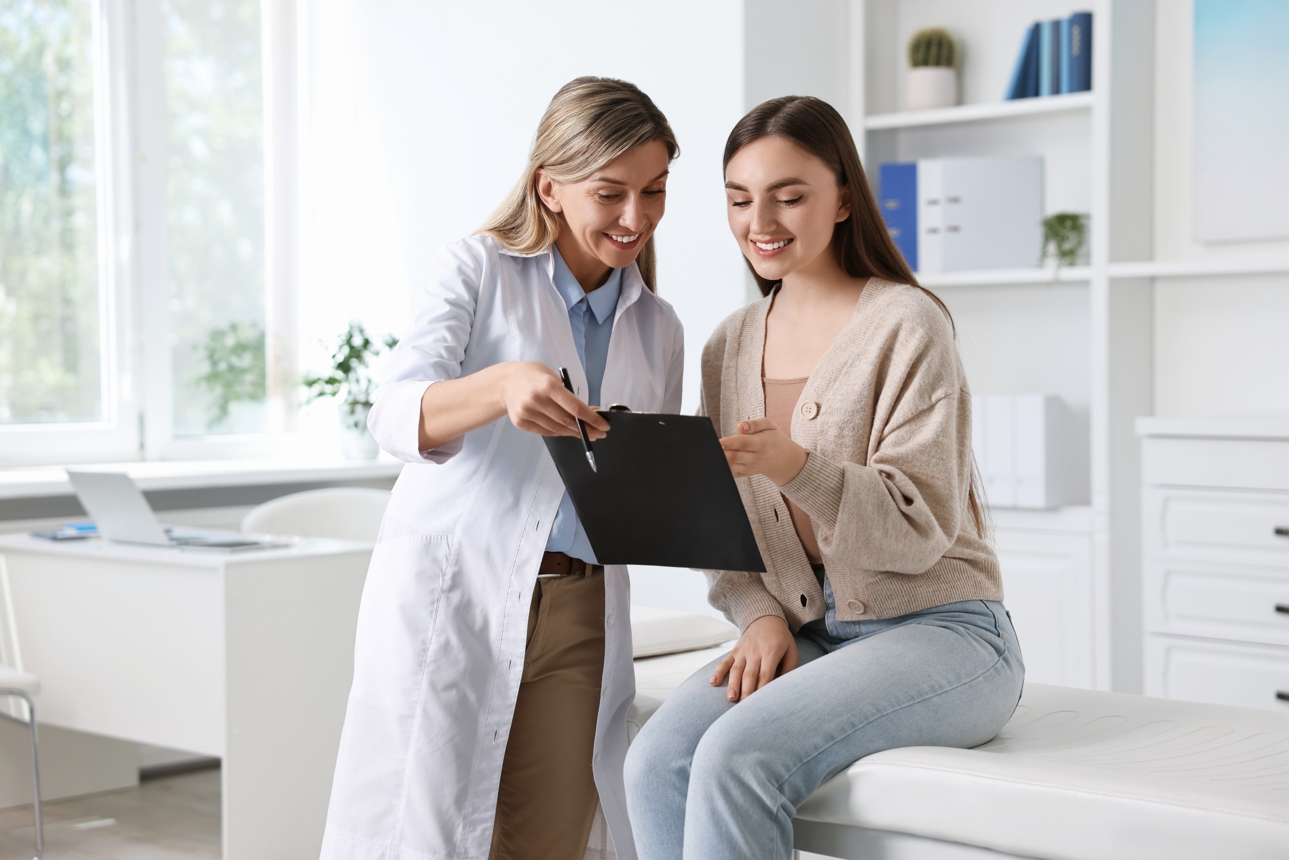 Female medical professional consulting with a patient