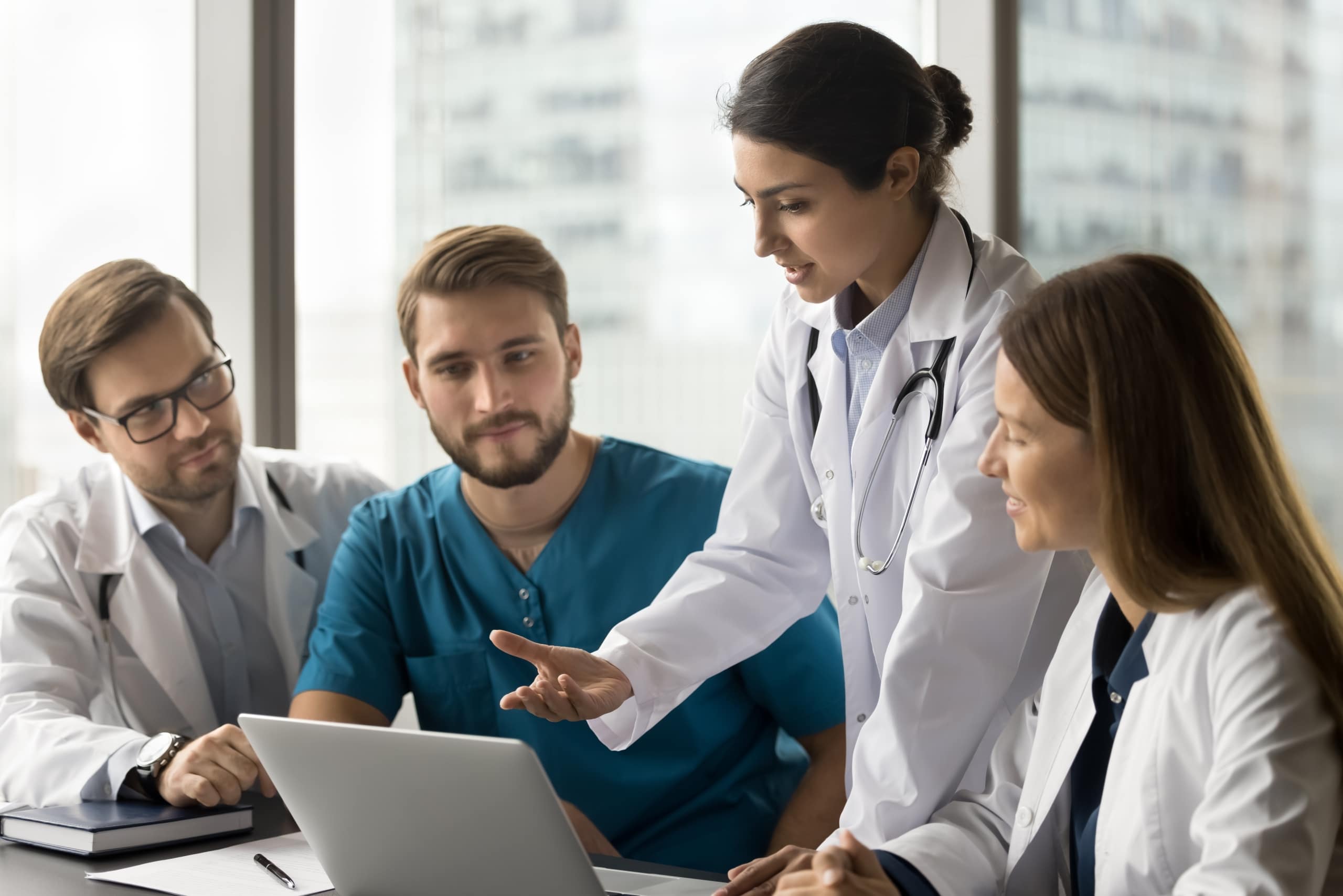 Indian medical professional in a meeting with other healthcare workers