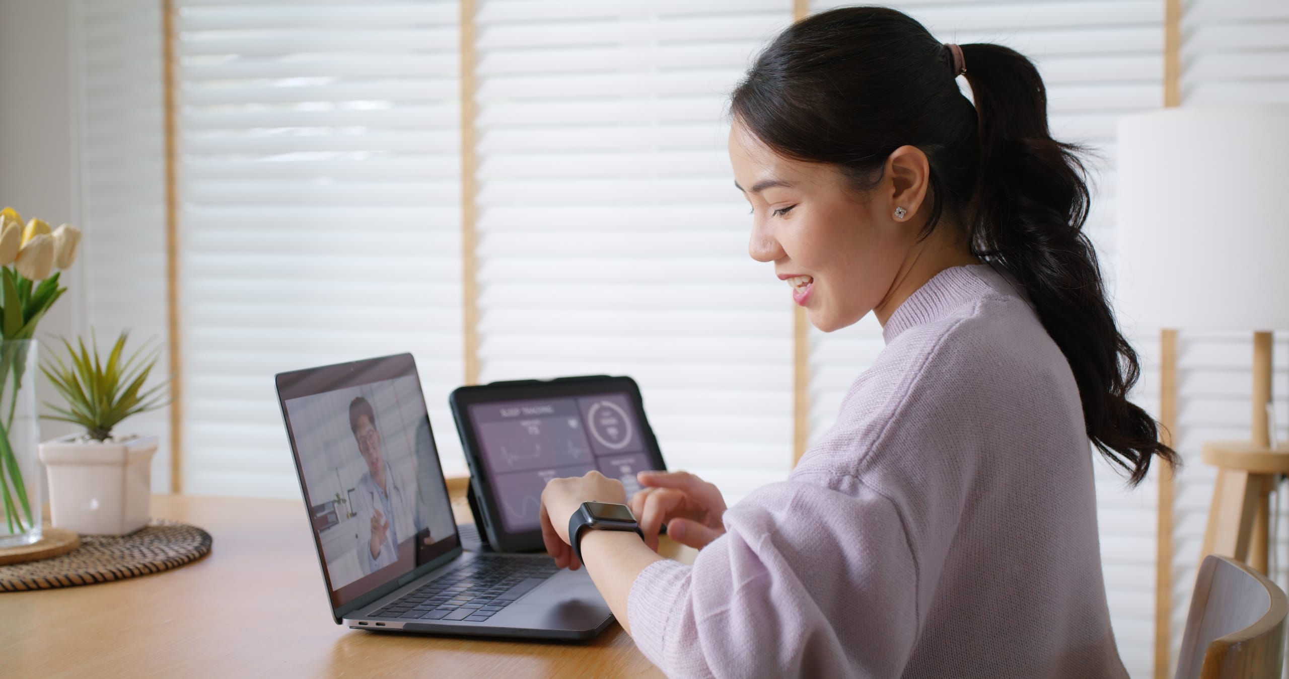 Asian woman in a video call with a healthcare professional