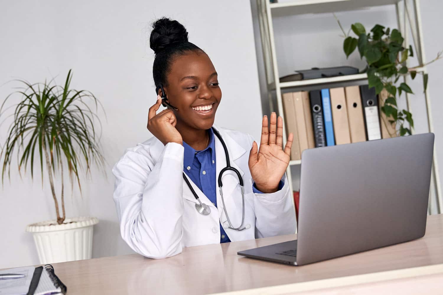 African-American medical professional wearing a headset